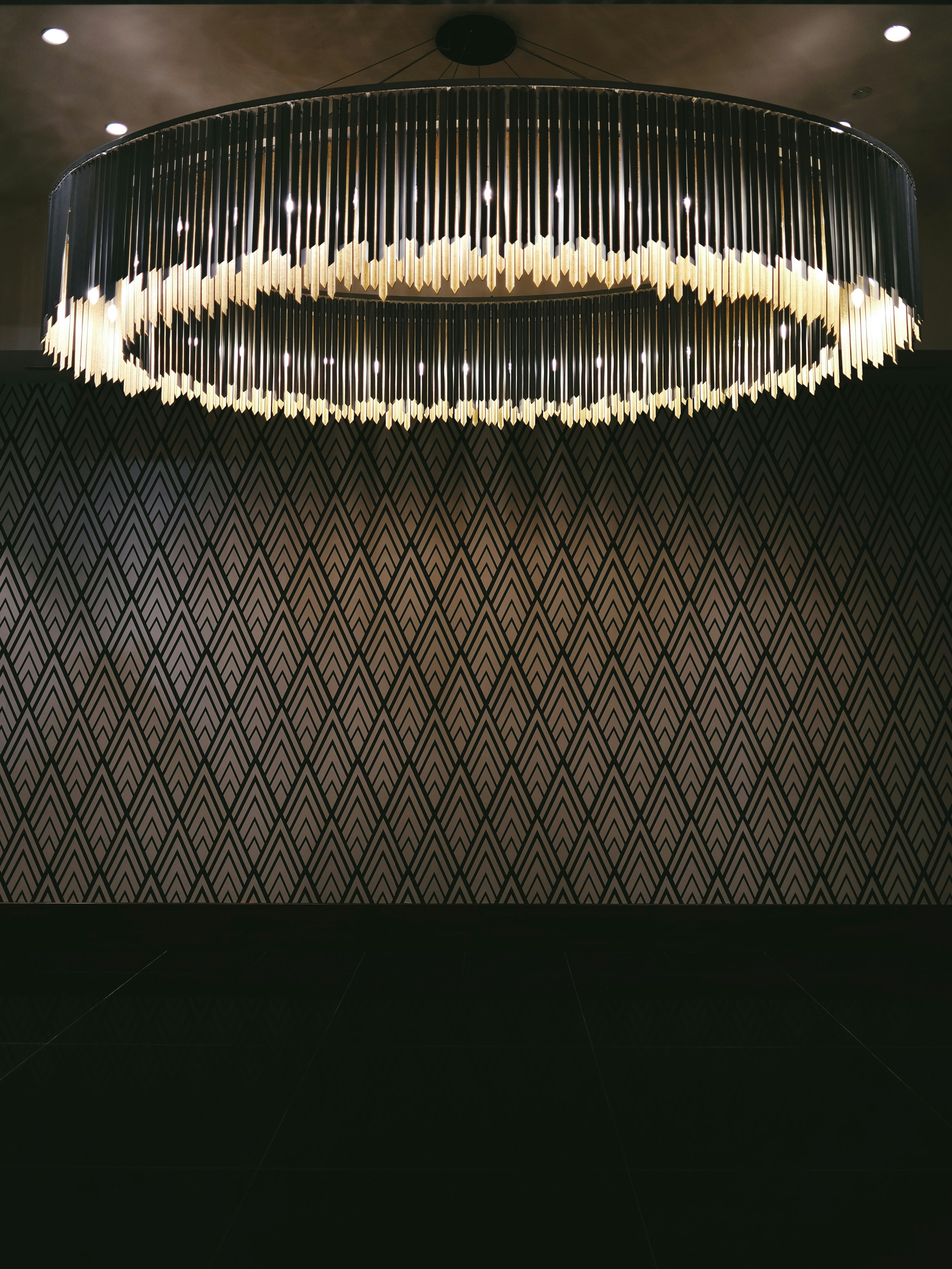 Chandelier installation in a luxury interior
