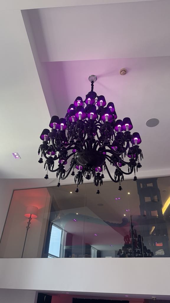 Black chandelier with purple shades