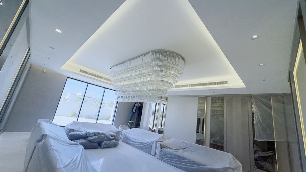 Large curved tiered crystal chandelier